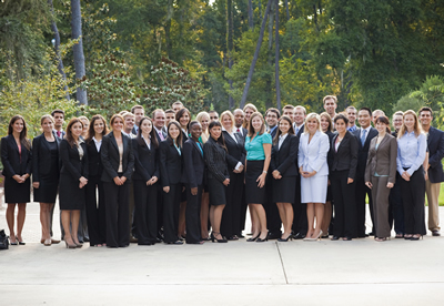 Professionals in business attire outside