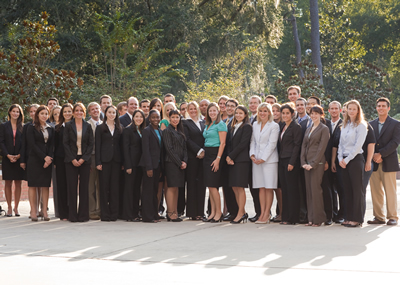 Professionals in business attire outside